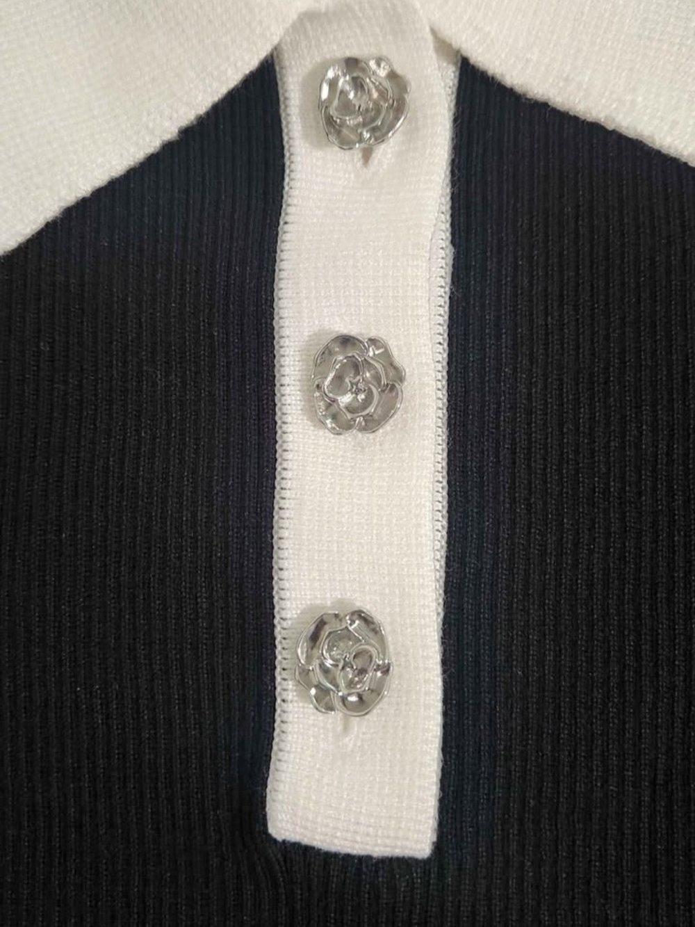 Karl Lagerfeld Black V-Neck Blouse with White Placket and Silver Flower Buttons.
